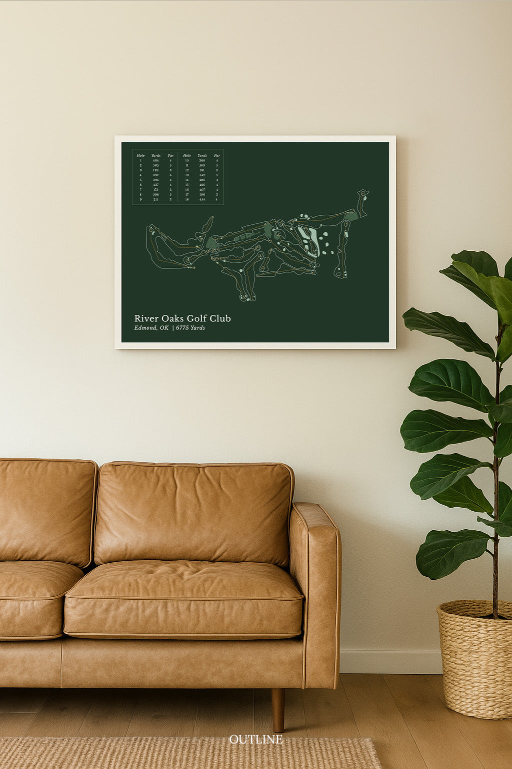 a framed illustration of a golf course, with a brown leather couch in the foreground and a potted plant to the right.